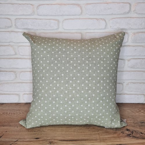 כרית ירוקה עם נקודות לבנות