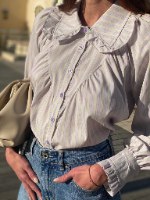 מכופתרת דול