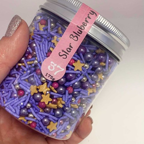 מקסי מיקס 37 - STAR BLUEBERRY | סוכריות ושוקולדים בגווני סגול וזהב . כוכבים ופנינים.